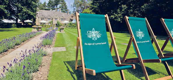 Green deck chairs outside Charingworth