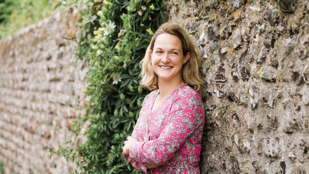 Lucy Hall of Lucy Claire Events leaning against a wall