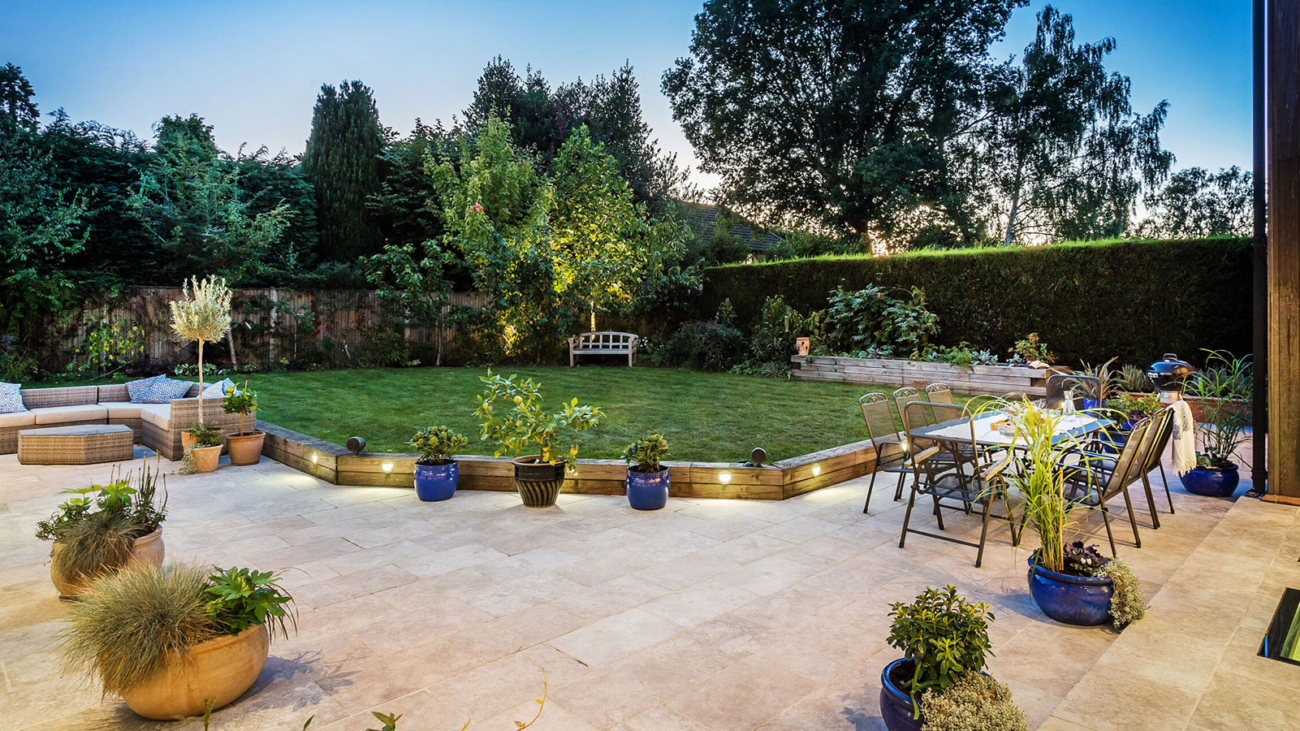 Large garden with seating and fairy lights
