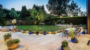 Large garden with seating and fairy lights