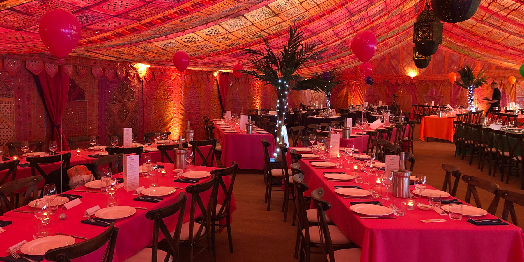 Event Marquee decorated with reds and oranges
