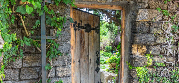 Wooden doorway into a walled garden