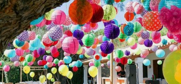Coloured lanterns hanging from a tree