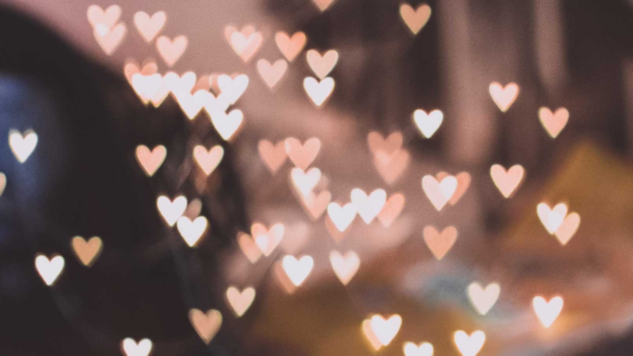 Hearts created from light in front of a blurred background