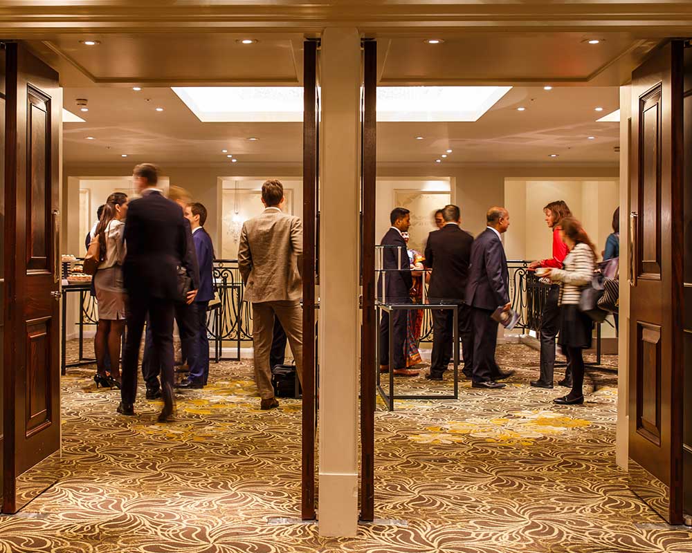 People waiting to go into a conference