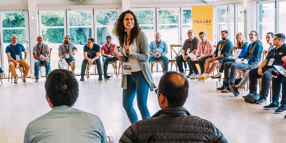 Speaker in the middle of a circle of people